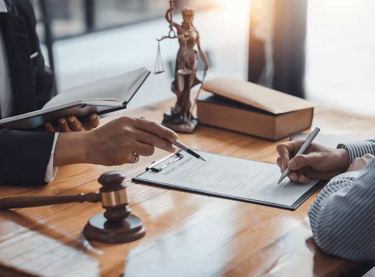 Legal consultation with documents and gavel.